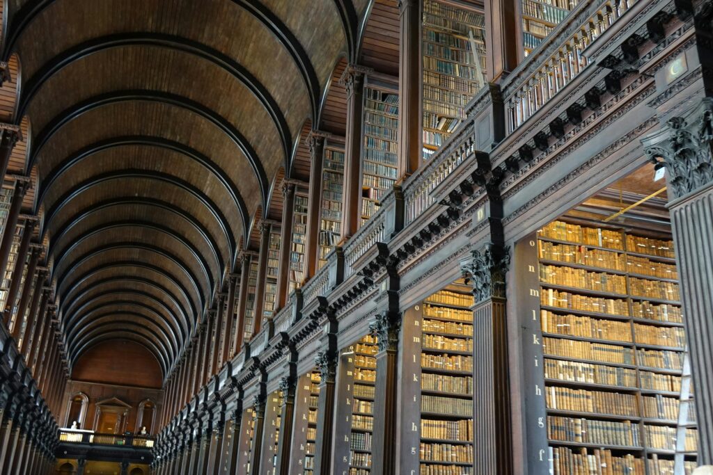 Expansive view of the historic Long Room library in Trinity College Dublin.